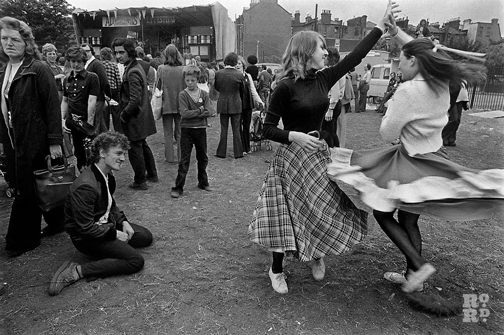 Woman dancing at festival in East London, photograph by David Hoffman.
