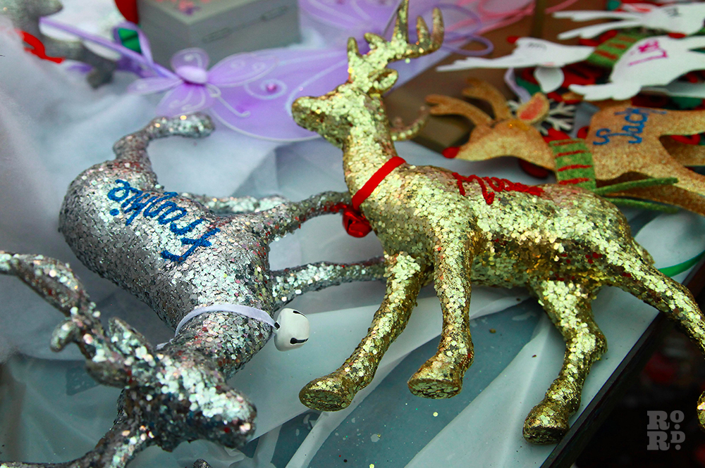 Sparkly glitter reindeer Christmas tree decorations in silver and gold.