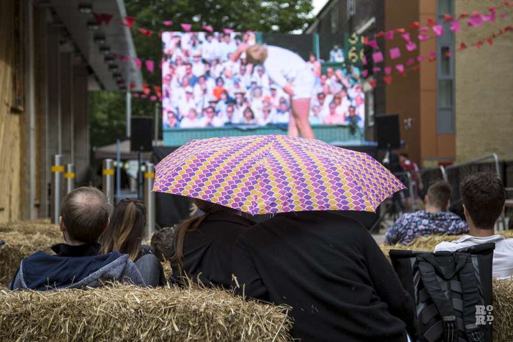 Straw bales, umbrellas, watching Wimbledon tennis on outdoor screen