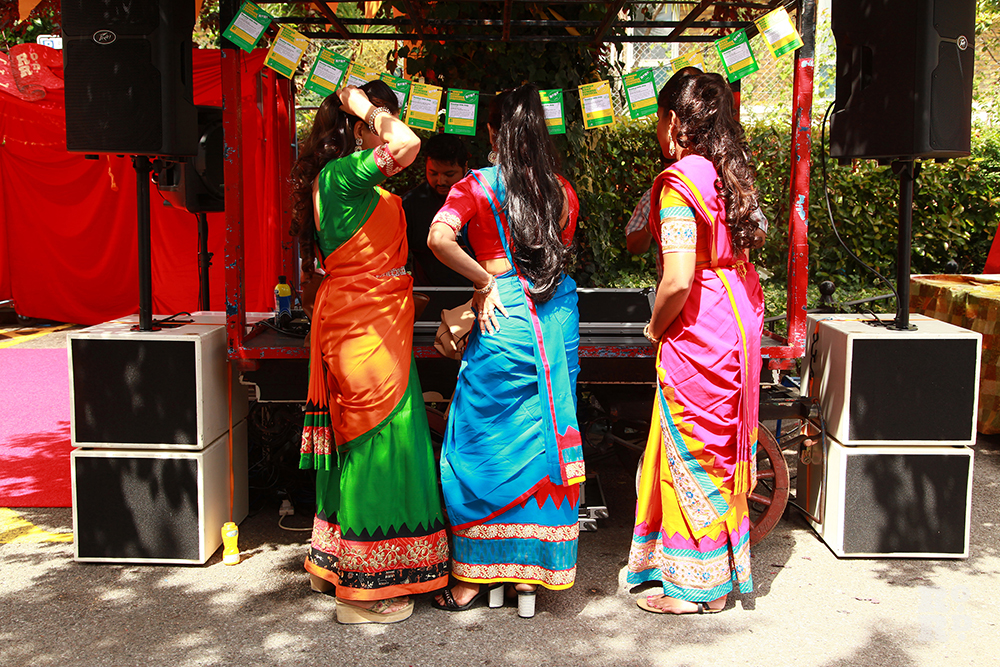 Bangladeshi dance troupe Tridhara in brightly coloured folk costumes at Roman Road Festival
