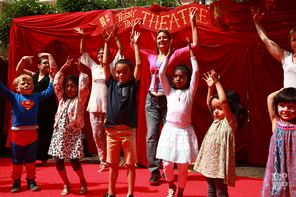Children at the outdoor Teeny Tiny Theatre doing Bollywood moves at Roman Road Festival