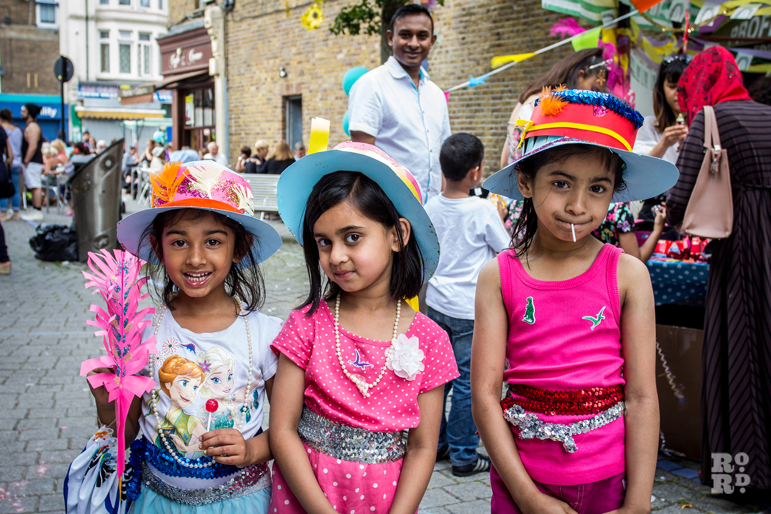 Three girls wearing Match Women hats made at the craft stall at Roman Road Festival 2016