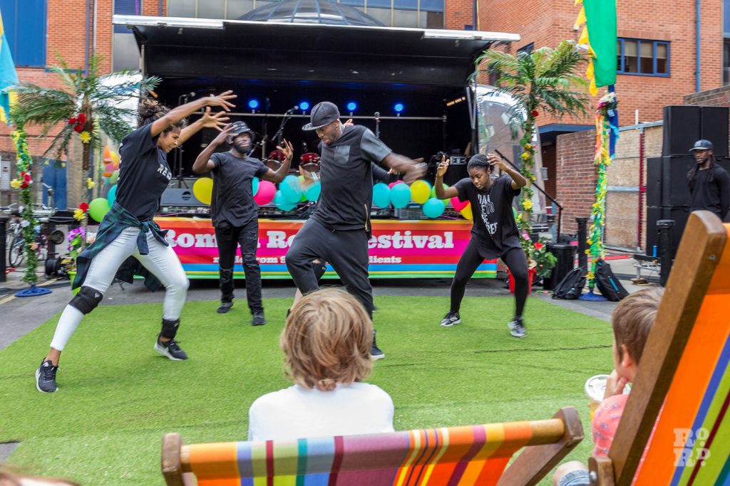 Hip hop dancers performing on artificial grass at Roman Road Summer Festival 2016