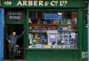 Gary Arber standing outside his stationery shop on Roman Road in June 2014.