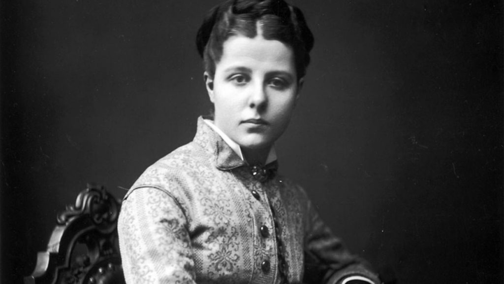 A portrait of Annie in her youth, sitting