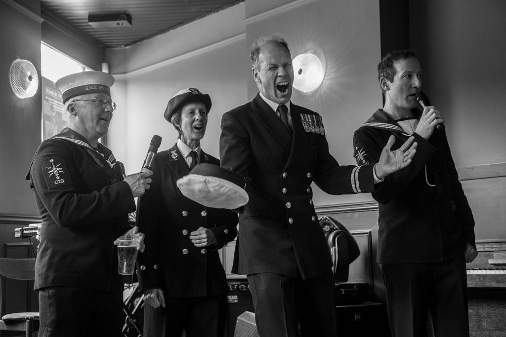Black and white photograph of sailors at the Bun Day celebrations 2017