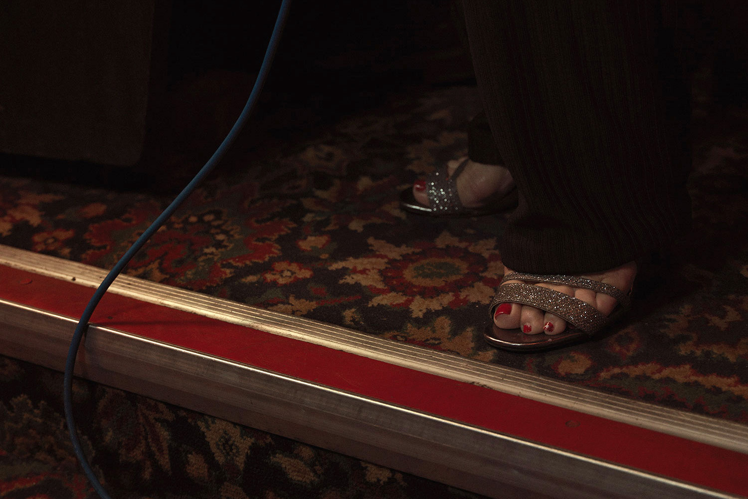 Painted toe nails, sandals, pub floor. Image from Last of the Old Crooners, Palm Tree pub by Tom Oldham