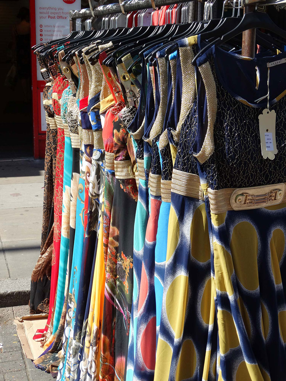 Colourful dresses for sale at Roman Road Market