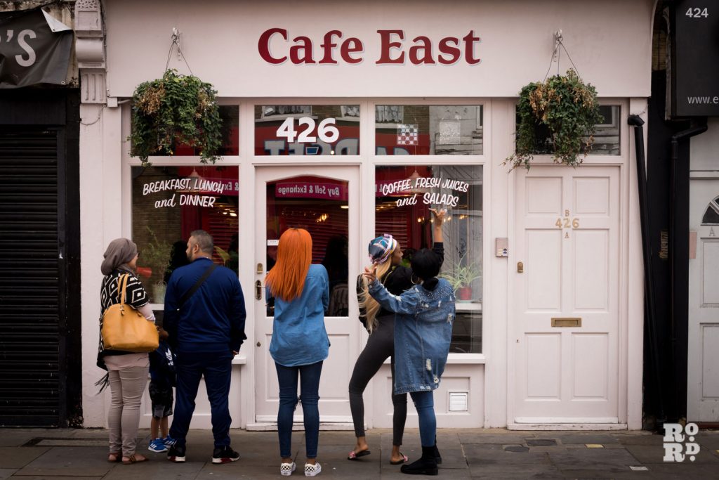 People outside Cafe East, on Roman Road London