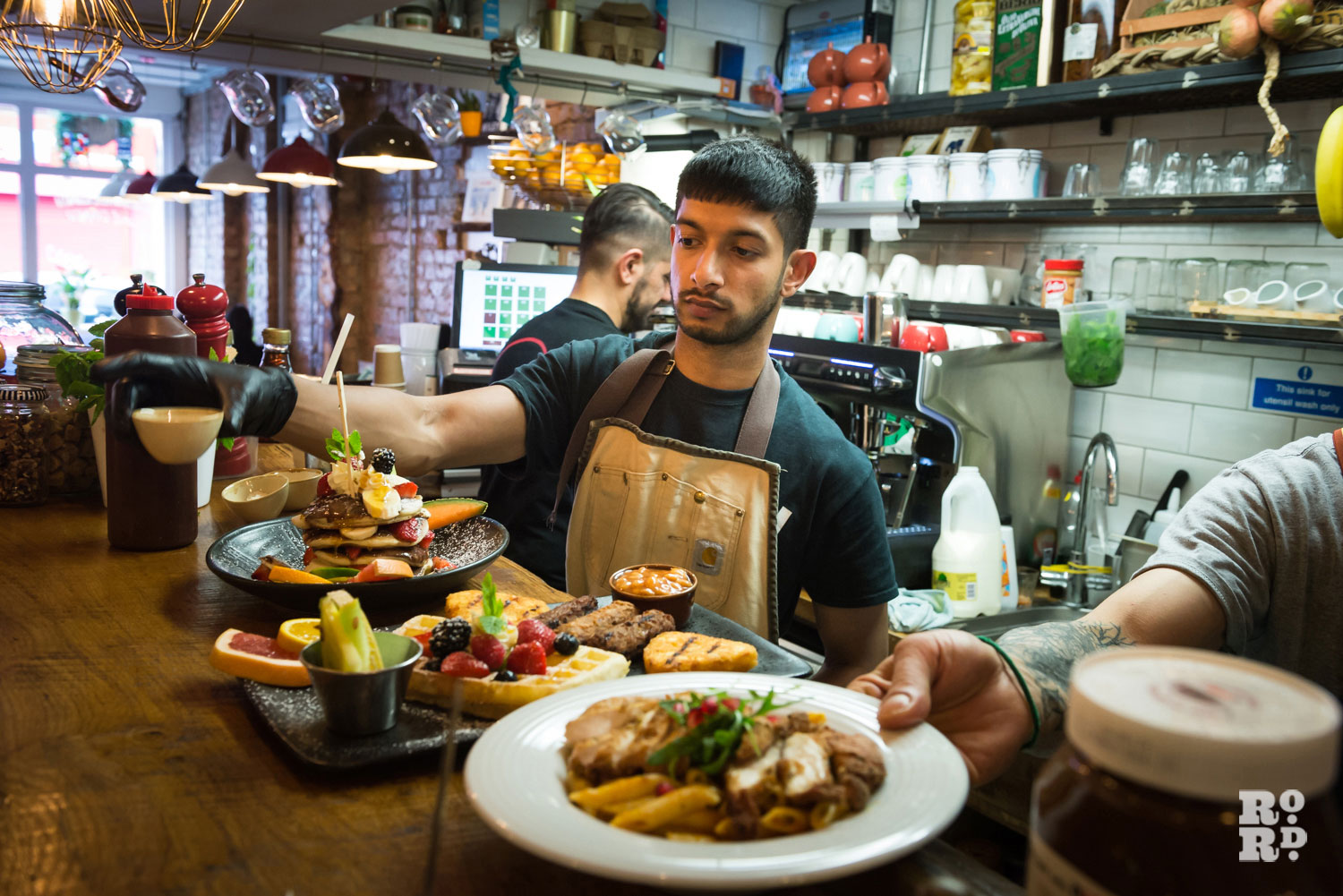 Chefs preparing brunch at Cafe East on Roman Road