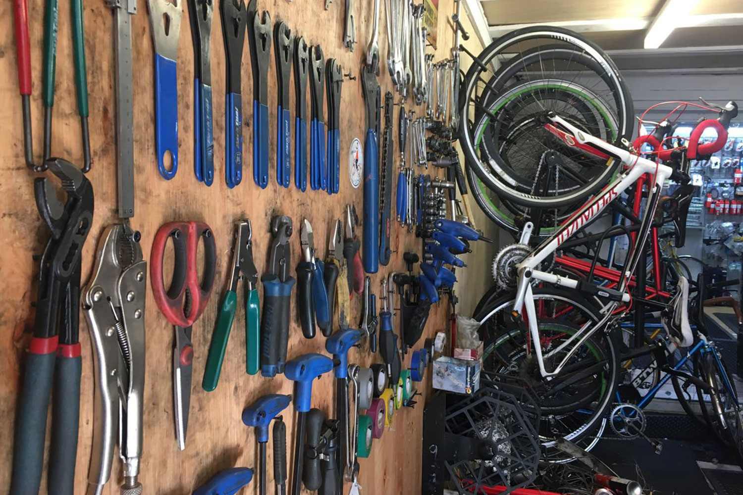 bikes and tools on the wall at Paradise cycle on Roman Road