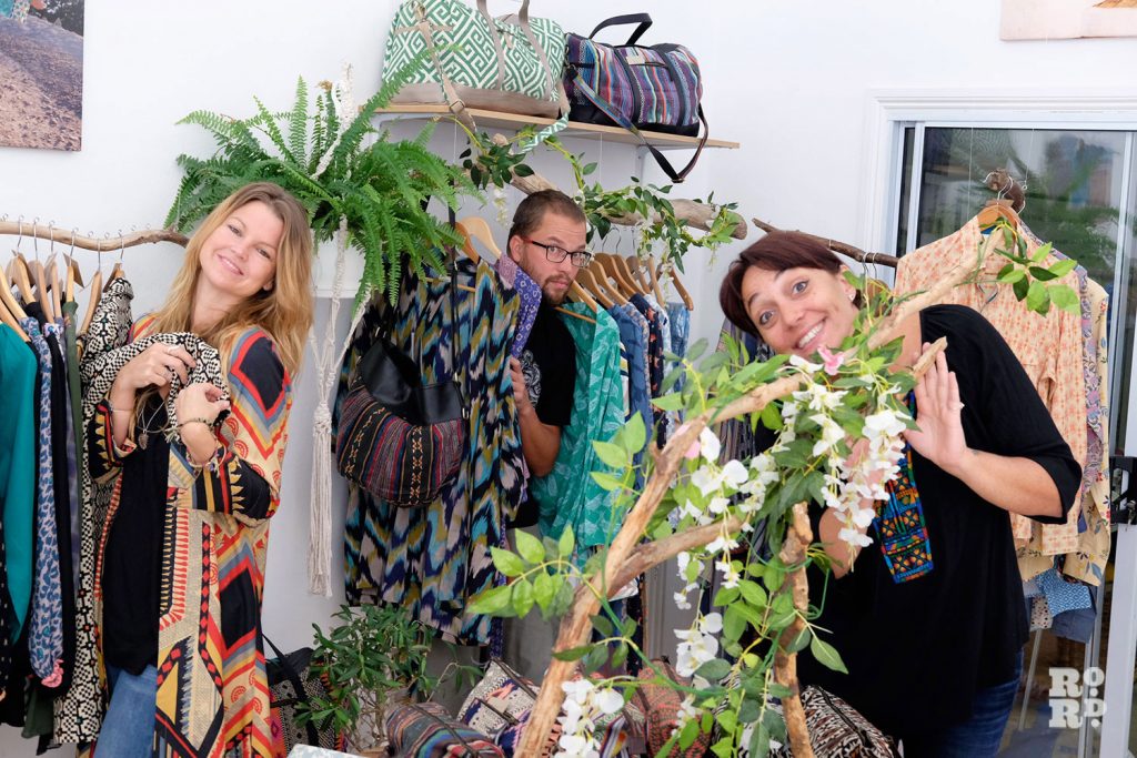 The three designers of Bamboo and Bee pose with some of their products