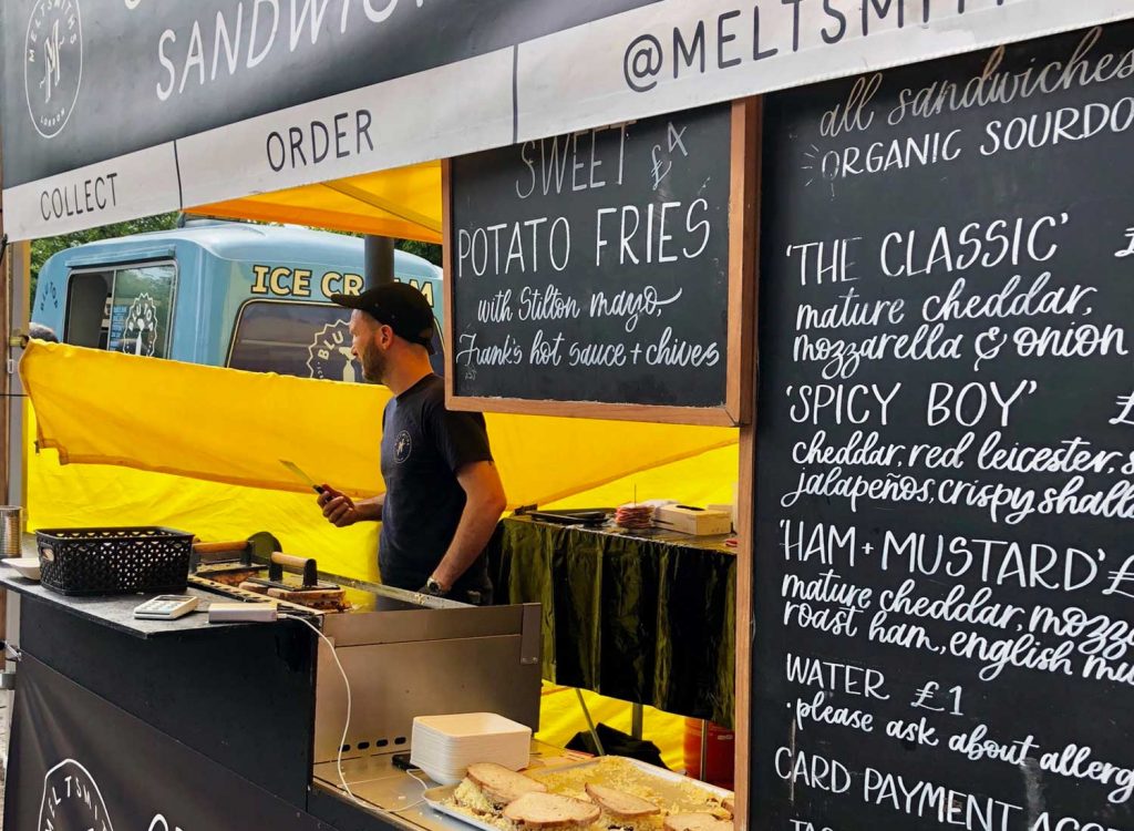 A man behind Meltsmith's stall selling toasted sandwiches