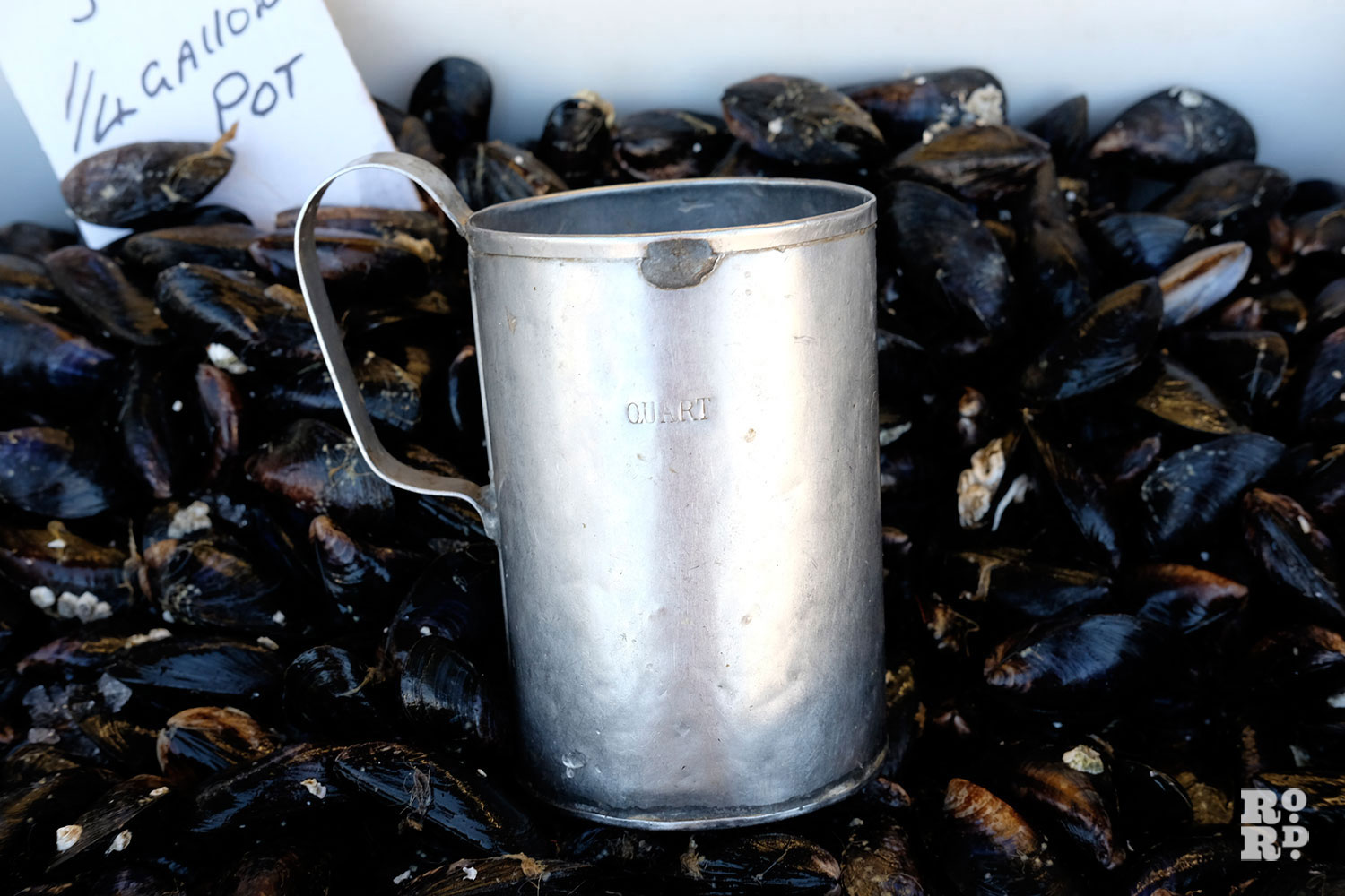  old quart cup used for measuring shellfish at East End fish stall