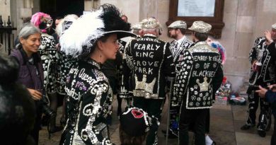 Pearly Kings and Queens of Blackheath and Grove Park standing on street