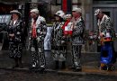 Pearly Kings and Queens raising money for charity on a Covent Garden Street.