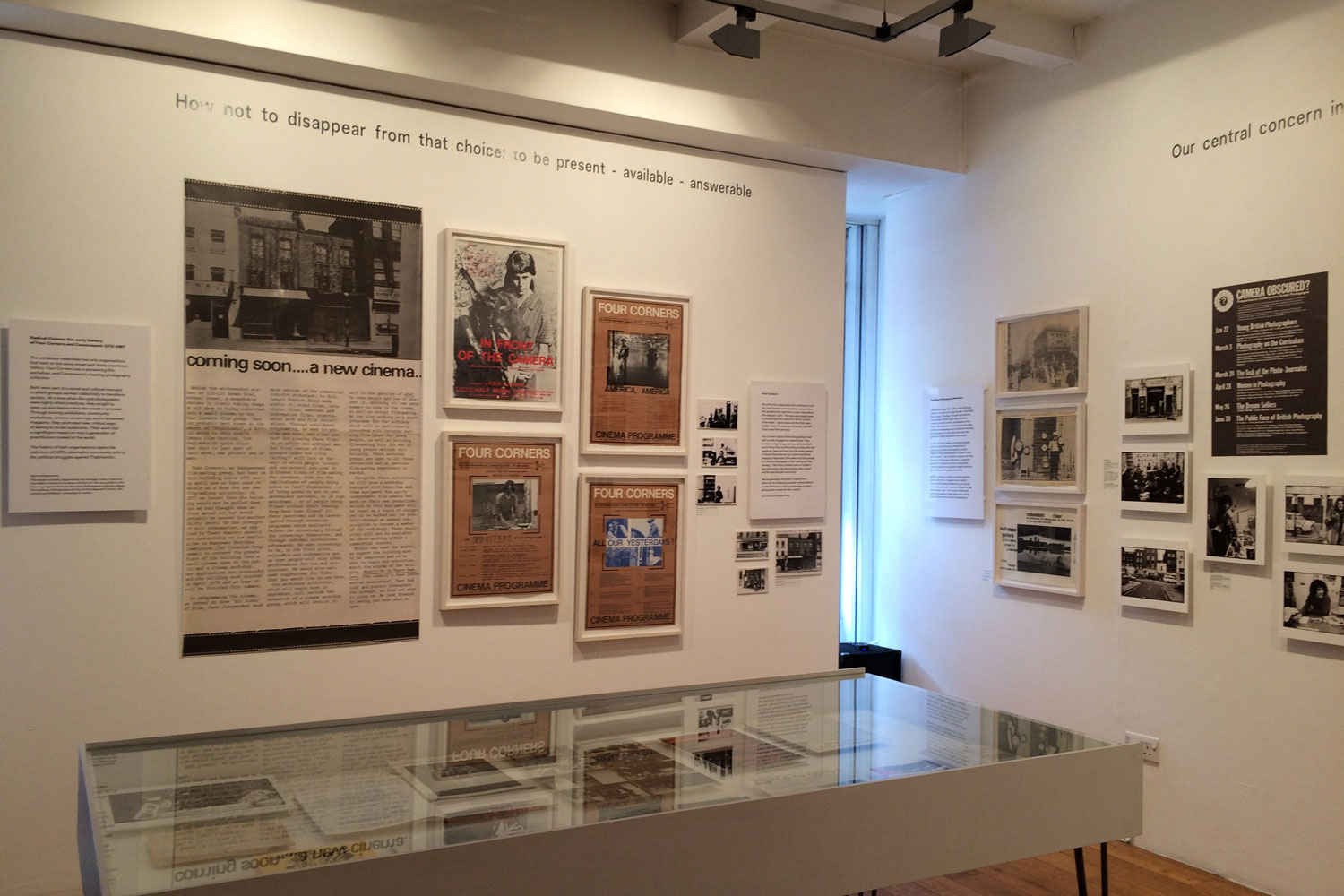 A more detailed photograph of the exhibition showing posters from a distance