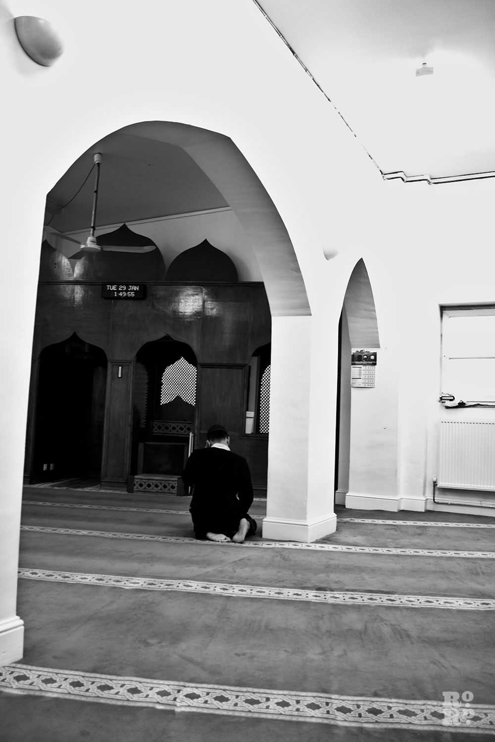 A man praying in the Bow Muslim Community Centre