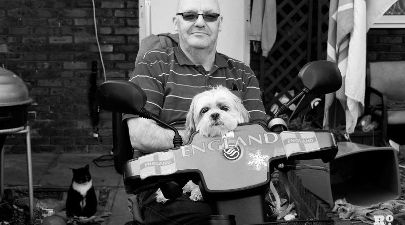 Chris Kimberley and his dog, Skye, outside their home in Bow, East London