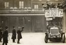 King George V raises his hat to a number 8 bus