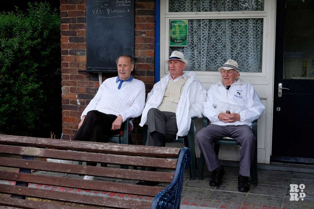 Terry, Micky, and Brian watching a game at the Victoria Park Bowls Club in East London
