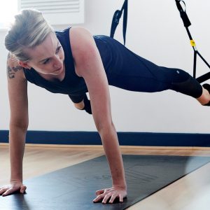 Yoga and fitness class using TRX suspension training