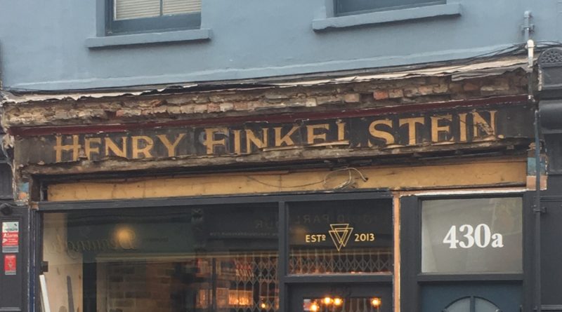 Old sign of Henry Finkelstein on Roman Road