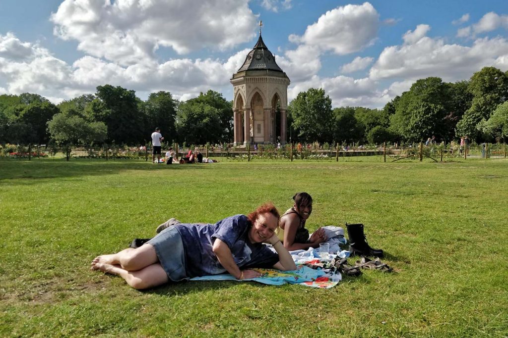 Daniella and her friend Michaela on the grass at the LGBT+ Pride Picnic in Victoria Park