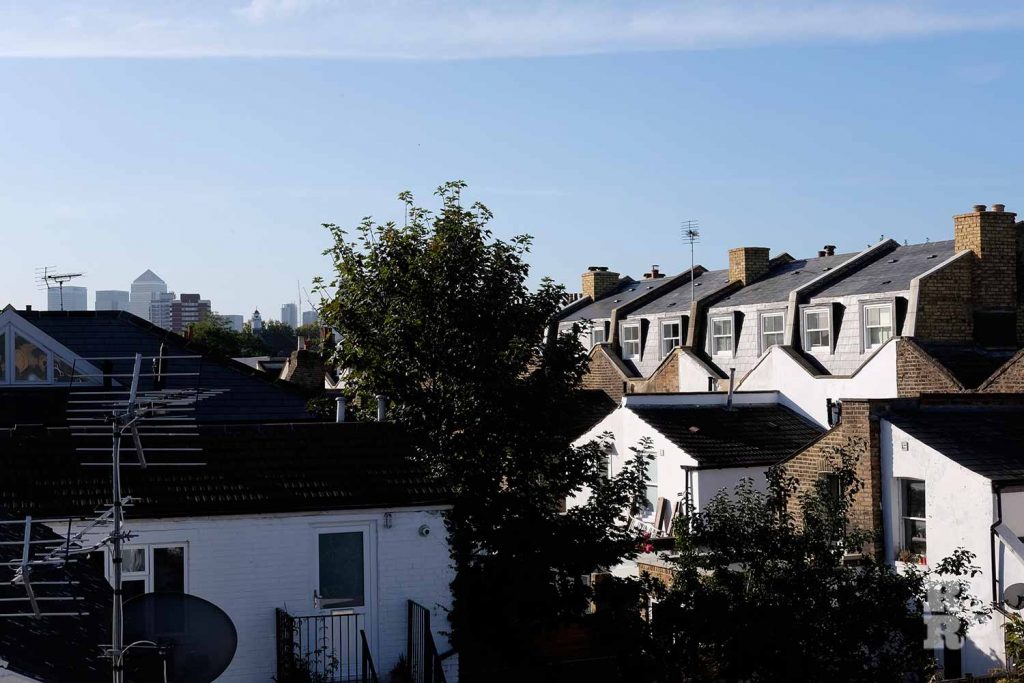 Valleys of butterfly roofs visible at the back of mansard roofs in Bow