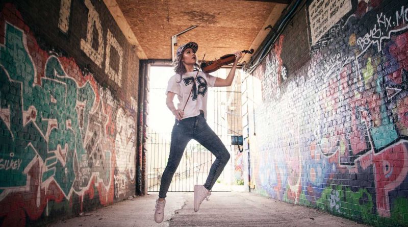 Tanya Cracknell aka The Grime Violinist jumping in a tunnel in Bow, East London