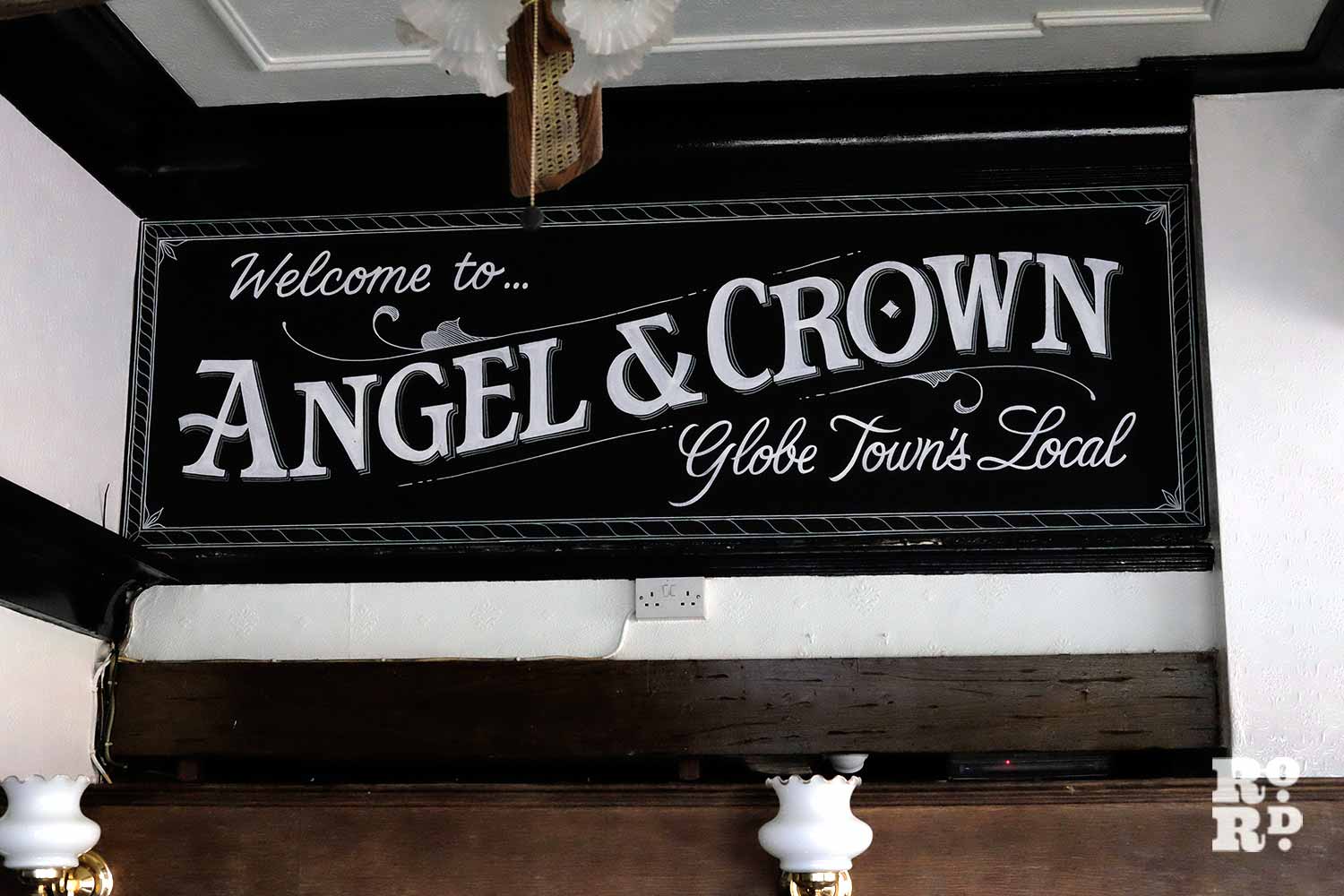 Signage inside Angel & Crown pub on Roman Road, painted by Luminor signwriters