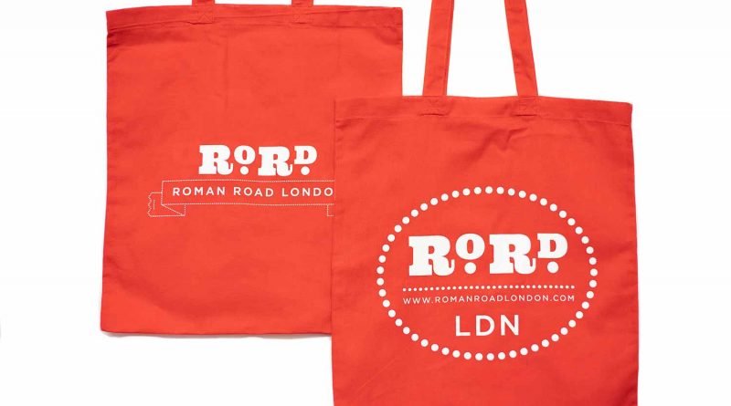 Back and front of red Roman Road LDN shopping top bag.
