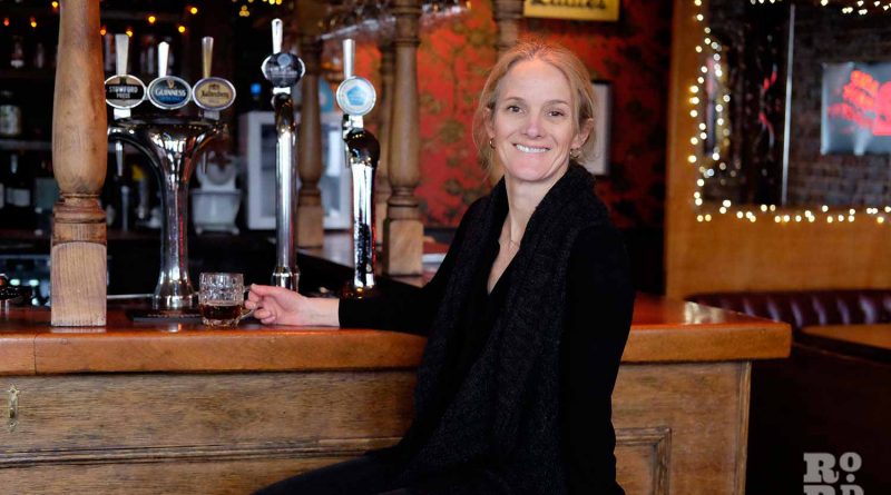 Claire Ashbridge Thomlinson founder of East London Brewery enjoying a half pint of Nightwatchman at The Florist pub