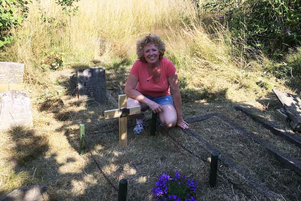 Sam Johnson at the grave of Sarah Chapman, who took part in the match girl riots at the Bryant and May factory in Bow, East London