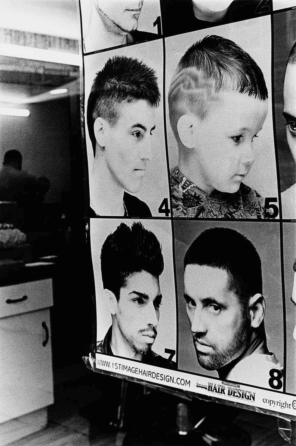 Barber shop, part of a series of photographs by Stephie Devred that captures the unique spirit of the East London street market, Roman Road Market.