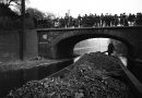 A coal barge passing under Bonner Bridge on Regents Canal, 1907