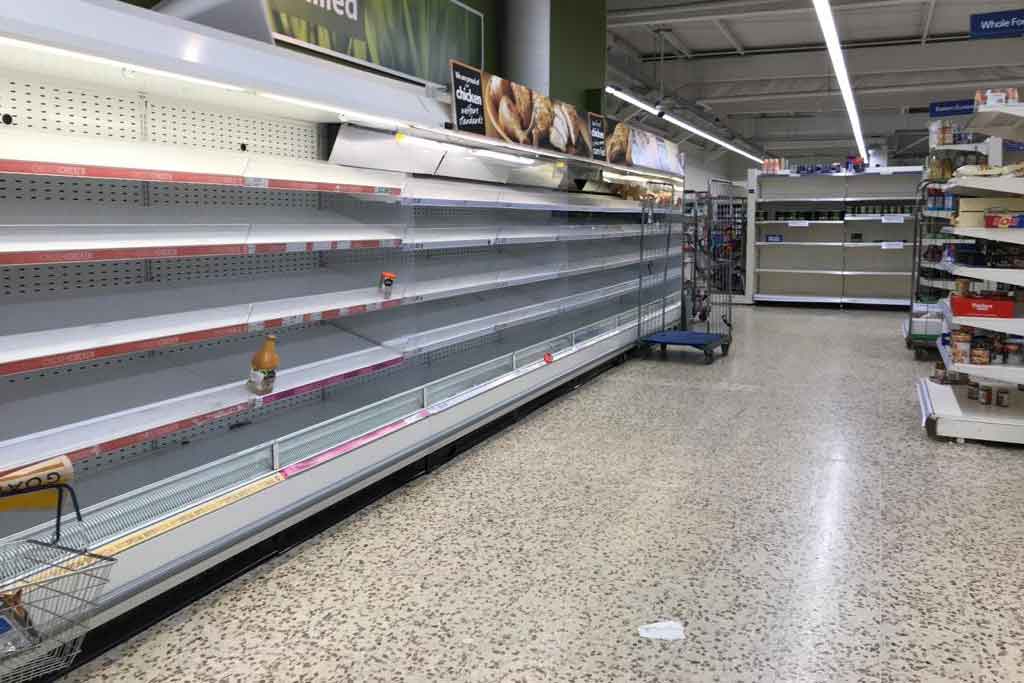 Deserted supermarket with empty shelves