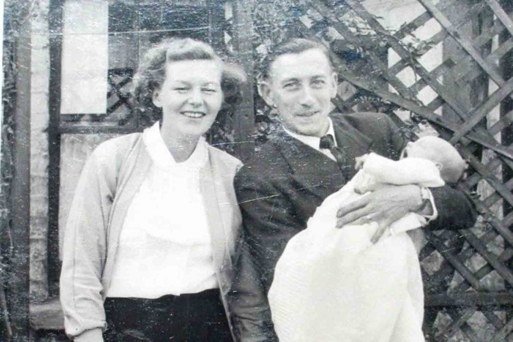 Parents holding baby Linda, 1955