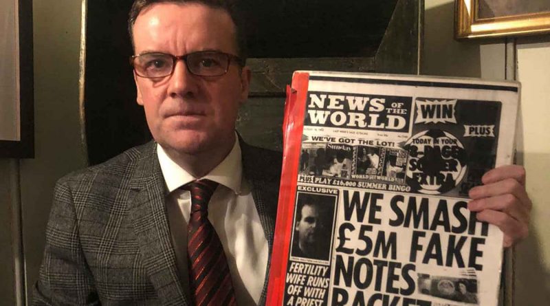 Gary Hutton, author of Product of a Postcode, holding newspaper clipping from News of the World