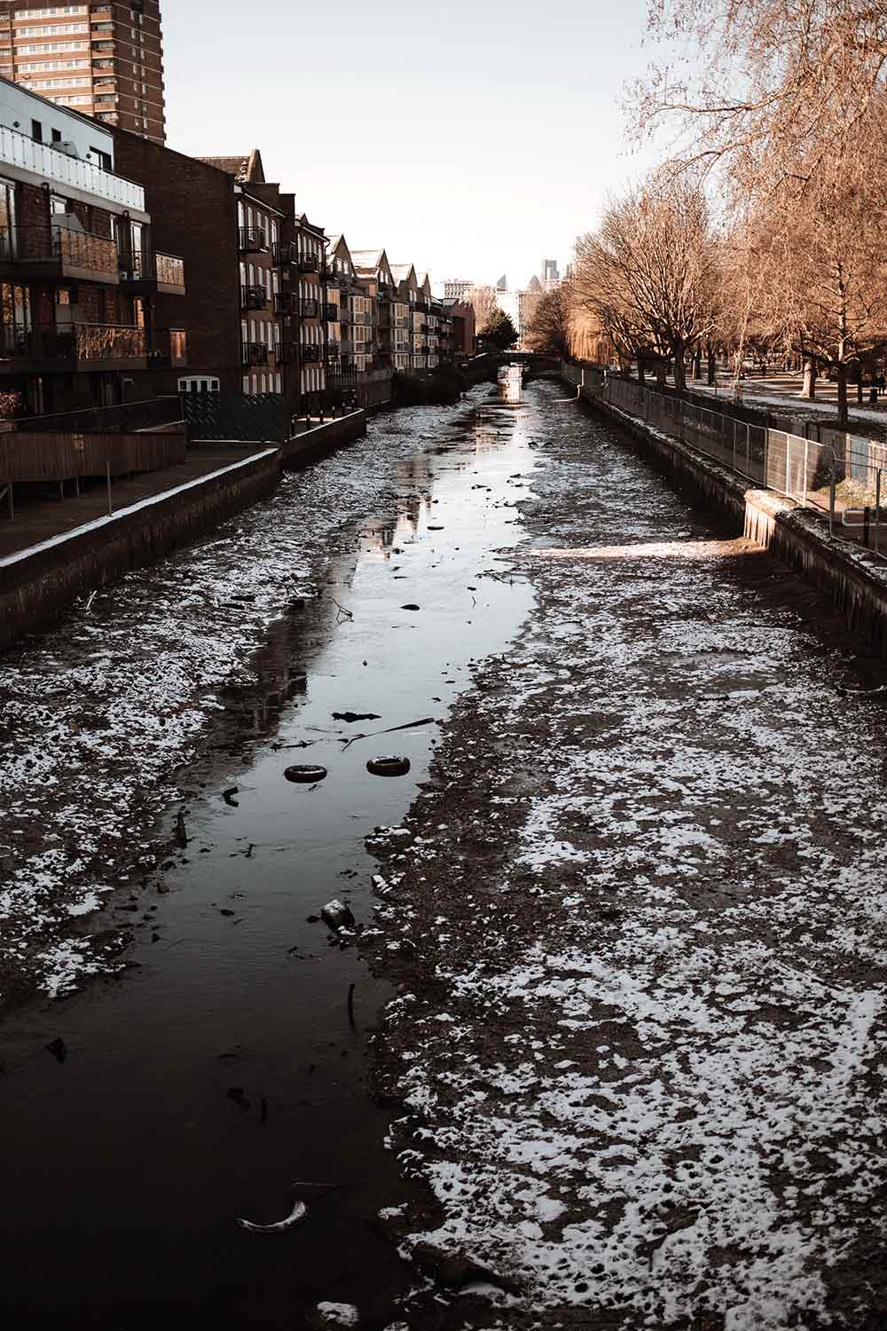Drained Hertford Union Canal, Victoria Park in the snow, 2021
