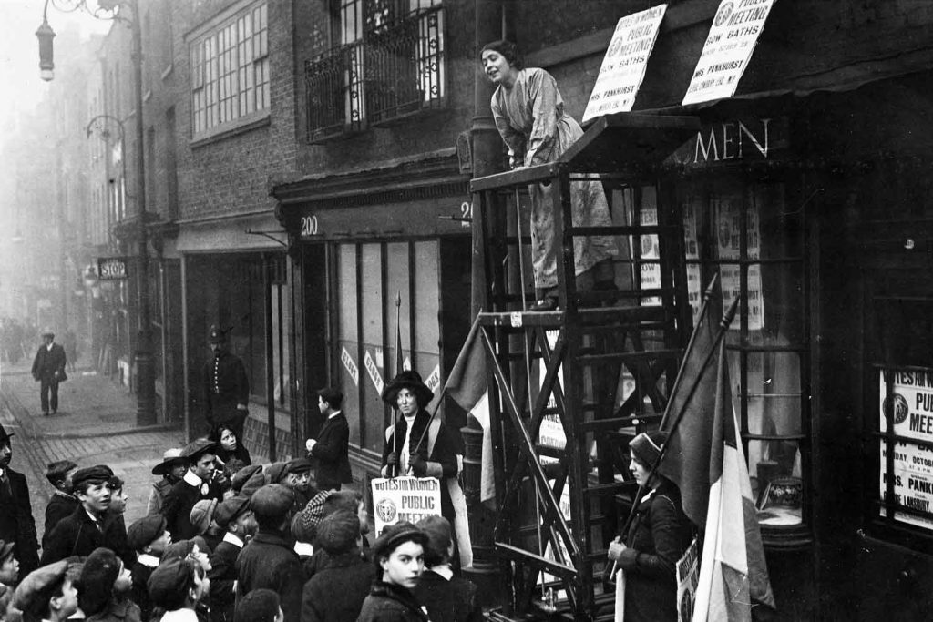 Sylvia Pankhurst addressing a crowd outside the headquarters of the East London Federation of Suffragettes, Old Ford Road, Bow.