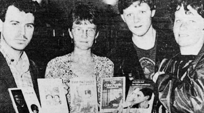 Black and white newspaper image of Chief librarian Anne Cunningham (centre left) receiving the books including The Colour Purple, with campaigner Paul Barlow (left).
