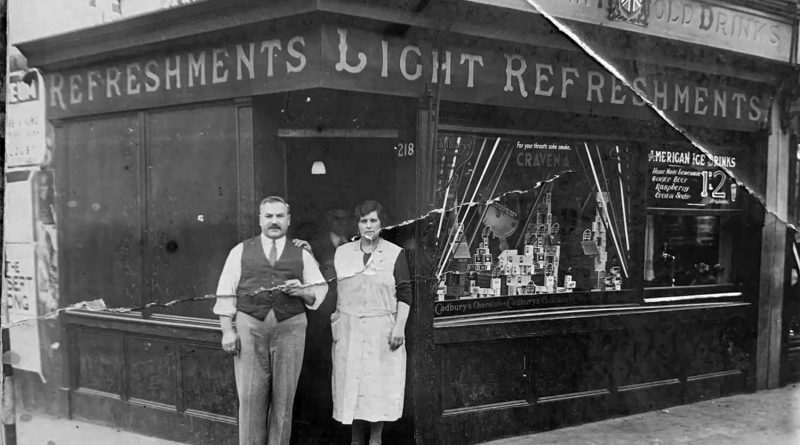 Luigi and Francesca Randolfi stand outside Randolfi's Café in a black-and-white photograph taken around 1930