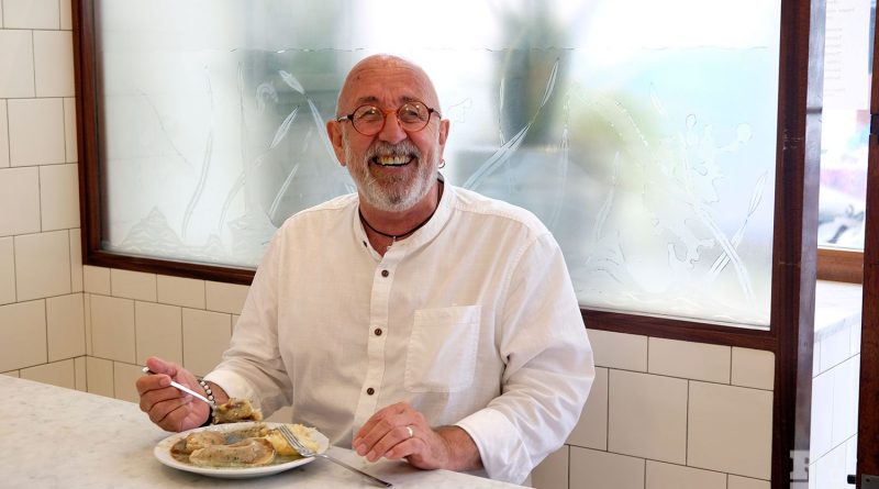 East End poet Chris Ross enjoying a plate of pie and mash at GKelly's on Roman Road.