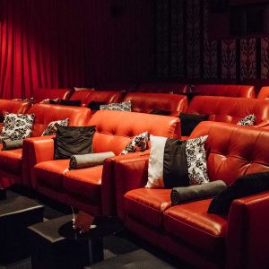 Red leather sofas at Studio 4, Genesis cinema, East London.