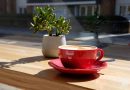 Coffee in a red cup and saucer, Symposium, East London.