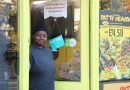 Deslyn, the owner of Patty Heaven outside her little yellow Caribbean food shop on Roman Road.