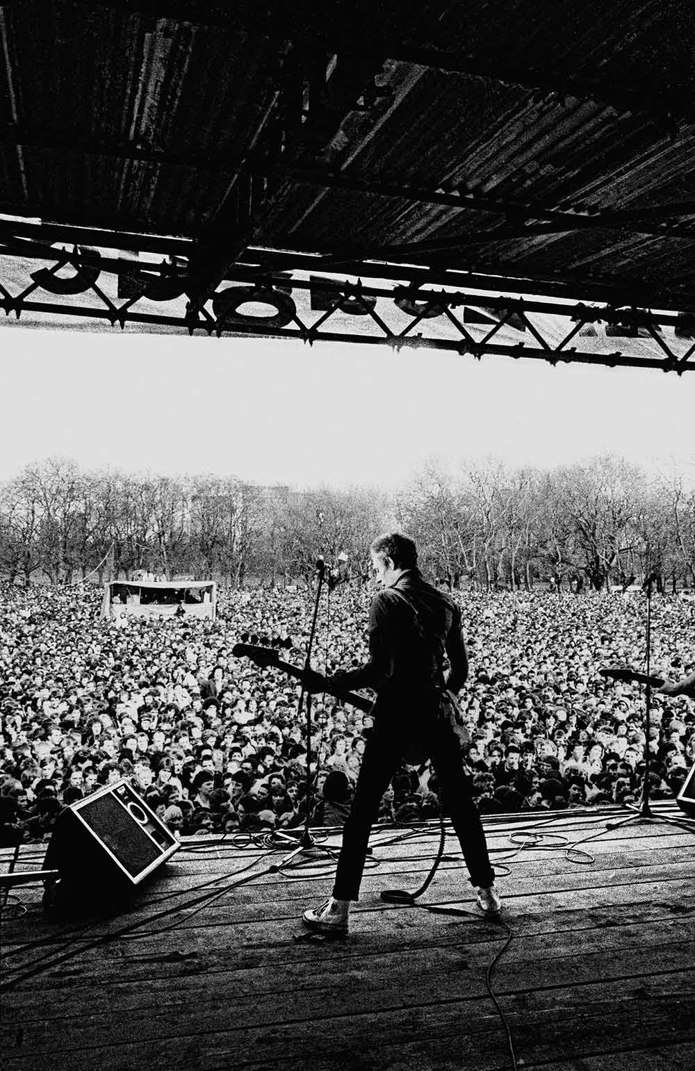 Paul Simonon, on stage at Rock Against Racism in Victoria Park, 1978.