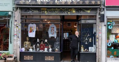 Tracy Buck, standing in front of her shop, Pride Tattos on Roman Road.
