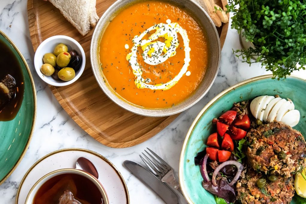 a bowl of lentil soup and a plate of salad and an open burger, Cafe Creme, Bow, East London